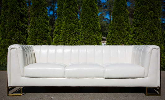 3 seater white leather sofa with gold accents