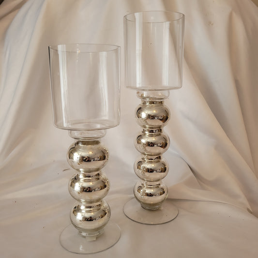 silver stemmed candle holders