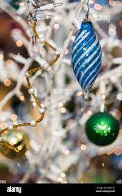 christmas globes in green, blue, white and gold